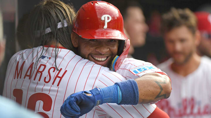 Philadelphia Phillies shortstop Edmundo Sosa (33)  celebrates his two-RBI double in the dugout with teammates during the seventh inning against the Colorado Rockies at Citizens Bank Park.