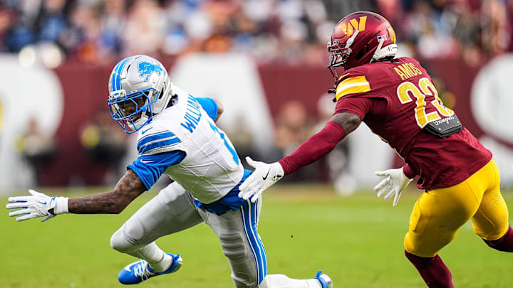 Detroit Lions wide receiver Jameson Williams (1) makes a catch against Washington Commanders cornerback Trey Amos (23) during the first half at Northwest Stadium in Landover, Md. on Sunday, November 9, 2025.