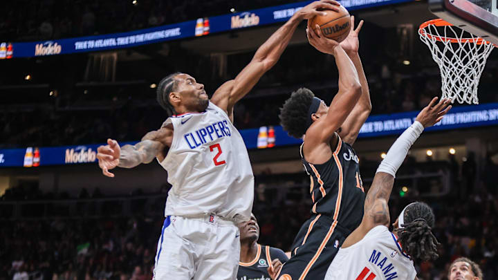  LA Clippers forward Kawhi Leonard (2) blocks the shot of Atlanta Hawks forward De'Andre Hunter (12) in the second quarter at State Farm Arena. Mandatory Credit: Brett Davis-Imagn Images