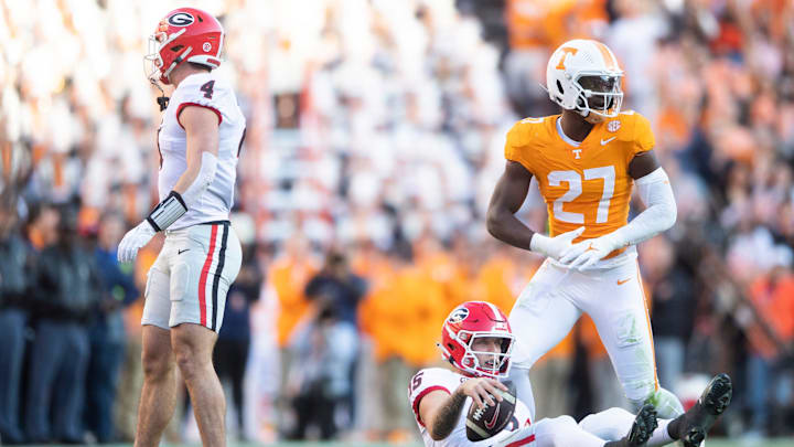 Georgia quarterback Carson Beck (15) is seen on the ground in front of Tennessee defensive lineman James Pearce Jr. (27) during a football game between Tennessee and Georgia at Neyland Stadium in Knoxville, Tenn., on Saturday, Nov. 18, 2023.