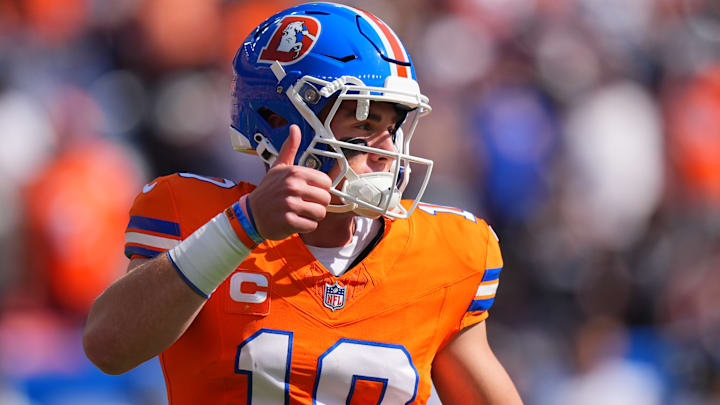 Denver Broncos quarterback Bo Nix (10) gives a thumbs up in the first quarter against the Las Vegas Raiders at Empower Field at Mile High.