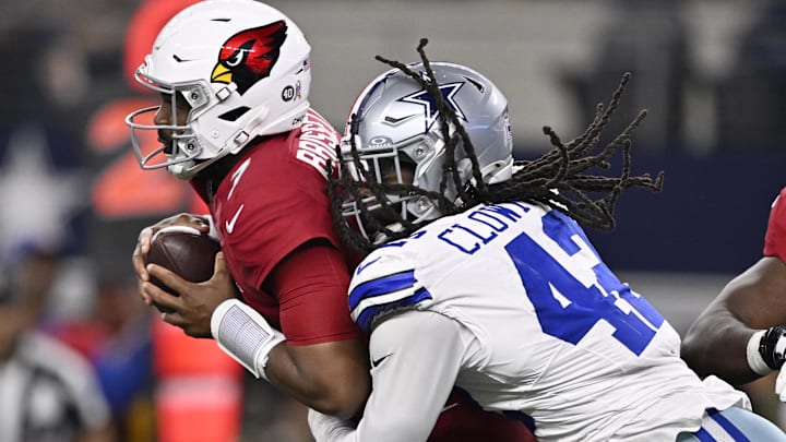 Nov 3, 2025; Arlington, Texas, USA;  Dallas Cowboys defensive end Jadeveon Clowney (42) sacks Arizona Cardinals quarterback Jacoby Brissett (7) in the first half at AT&T Stadium. Mandatory Credit: Jerome Miron-Imagn Images