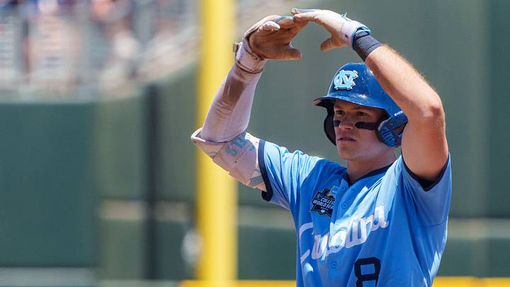 Jun 17, 2026; Omaha, NE, USA; North Carolina Tar Heels center fielder Owen Hull (8) celebrates after driving in a run on a double against the West Virginia Mountaineers during the fourth inning at Charles Schwab Field. Mandatory Credit: Dylan Widger-Imagn Images