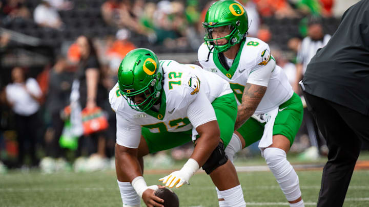 Oregon offensive lineman Iapani Laloulu snaps the ball to Oregon quarterback Dillon Gabriel during warm ups as the Oregon State Beavers host the Oregon Ducks Saturday, Sept. 14, 2024 at Reser Stadium in Corvallis, Ore.