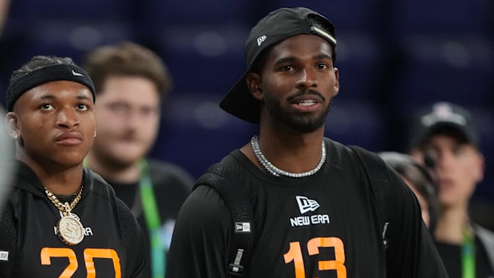 Mar 1, 2025; Indianapolis, IN, USA; Colorado wideout Jimmy Horn (WO20) and Colorado quarterback Shadeur Sanders (QB13) during the 2025 NFL Combine at Lucas Oil Stadium. 