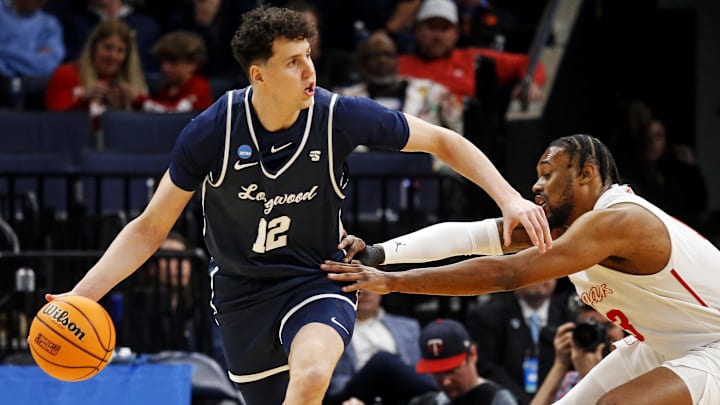 Mar 22, 2024; Memphis, TN, USA;  Longwood Lancers center Szymon Zapala (12) handles the ball against
