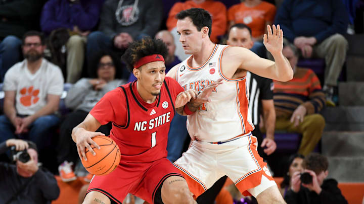 NC State Wolfpack forward Darrion Williams (1) is defended by Clemson Tigers forward Nick Davidson (11) Tuesday, Jan. 20, 2026, during the NCAA men’s basketball game at Littlejohn Coliseum in Clemson, South Carolina. NC State Wolfpack forward Darrion Williams (1) is defended by Clemson Tigers forward Nick Davidson (11) Tuesday, Jan. 20, 2026, during the NCAA men’s basketball game at Littlejohn Coliseum in Clemson, South Carolina.