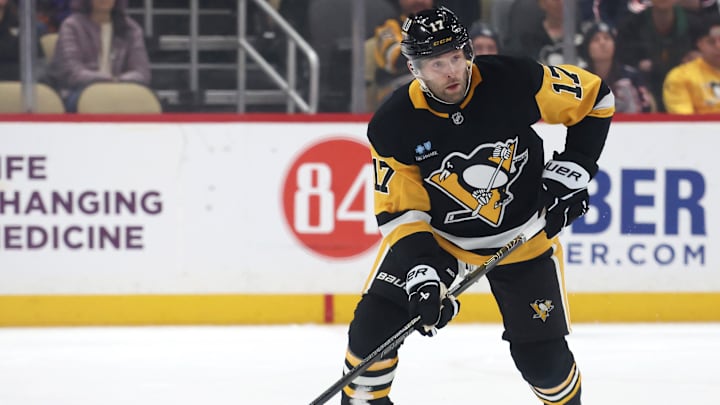 Mar 21, 2025; Pittsburgh, Pennsylvania, USA;  Pittsburgh Penguins right wing Bryan Rust (17) skates up ice with the puck against the Columbus Blue Jackets during the first period at PPG Paints Arena. Mandatory Credit: Charles LeClaire-Imagn Images