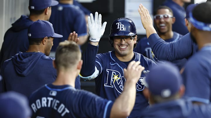 Apr 27, 2024; Chicago, Illinois, USA; Tampa Bay Rays first baseman Austin Shenton (54) celebrates with teammates after hitting a solo home run against the Chicago White Sox during the fifth inning at Guaranteed Rate Field. Mandatory Credit: Kamil Krzaczynski-Imagn Images
