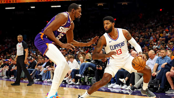 Apr 9, 2024; Phoenix, Arizona, USA; LA Clippers forward Paul George (13) handles the ball against Phoenix Suns forward Kevin Durant (35) during the first quarter at Footprint Center. Mandatory Credit: Mark J. Rebilas-Imagn Images Apr 9, 2024; Phoenix, Arizona, USA; LA Clippers forward Paul George (13) handles the ball against Phoenix Suns forward Kevin Durant (35) during the first quarter at Footprint Center. Mandatory Credit: Mark J. Rebilas-Imagn Images