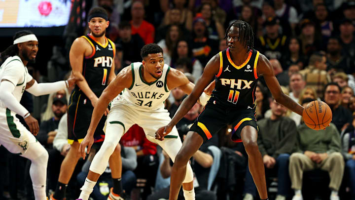 Phoenix Suns center Bol Bol handles the ball against Milwaukee Bucks forward Giannis Antetokounmpo during the first quarter at Footprint Center on February 6, 2024.