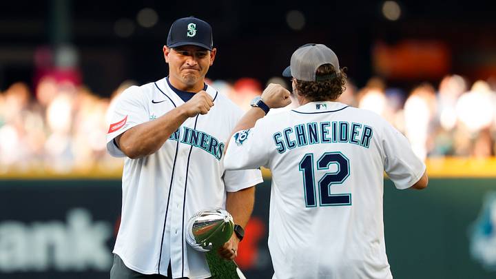 Jul 21, 2026; Seattle, Washington, USA; Seattle Seahawks coach Mike Macdonald, left, bumps fists with general manager John Schneider before a game between the Seattle Mariners and Cincinnati Reds at T-Mobile Park. Mandatory Credit: Joe Nicholson-Imagn Images Jul 21, 2026; Seattle, Washington, USA; Seattle Seahawks coach Mike Macdonald, left, bumps fists with general manager John Schneider before a game between the Seattle Mariners and Cincinnati Reds at T-Mobile Park. Mandatory Credit: Joe Nicholson-Imagn Images