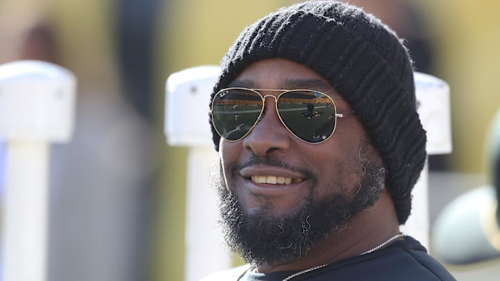 Pittsburgh Steelers coach Mike Tomlin sits on the sidelines.