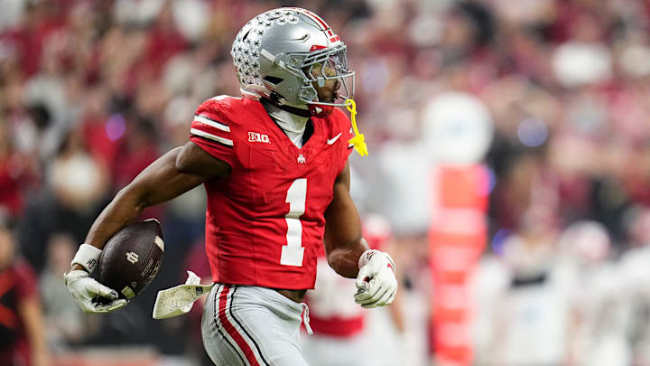 Ohio State Buckeyes cornerback Davison Igbinosun (1) celebrates an interception during the first half of the Big Ten Conference championship game against the Indiana Hoosiers at Lucas Oil Stadium in Indianapolis on Dec. 6, 2025.