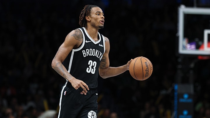 Mar 16, 2026; Brooklyn, New York, USA;  Brooklyn Nets center Nic Claxton (33) dribbles up court against the Portland Trail Blazers during the second half at Barclays Center. Mandatory Credit: Vincent Carchietta-Imagn Images