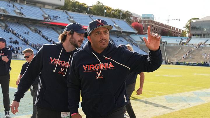 Oct 25, 2025; Chapel Hill, North Carolina, USA; Virginia Cavaliers head coach Tony Elliott runs off the field after defeating the North Carolina Tar Heels in overtime at Kenan Stadium. Mandatory Credit: Bob Donnan-Imagn Images Oct 25, 2025; Chapel Hill, North Carolina, USA; Virginia Cavaliers head coach Tony Elliott runs off the field after defeating the North Carolina Tar Heels in overtime at Kenan Stadium. Mandatory Credit: Bob Donnan-Imagn Images