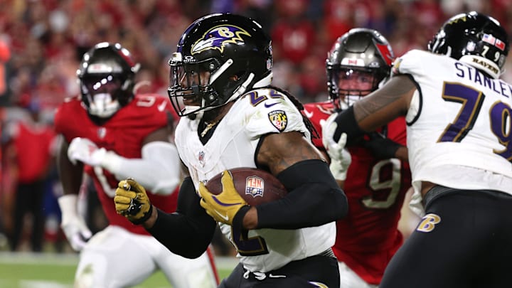 Oct 21, 2024; Tampa, Florida, USA; Baltimore Ravens running back Derrick Henry (22) runs with the ball against the Tampa Bay Buccaneers during the second half at Raymond James Stadium. Mandatory Credit: Kim Klement Neitzel-Imagn Images