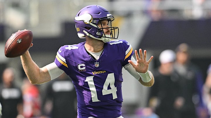Sep 15, 2024; Minneapolis, Minnesota, USA; Minnesota Vikings quarterback Sam Darnold (14) throws a pass against the San Francisco 49ers during the first quarter U.S. Bank Stadium. Mandatory Credit: Jeffrey Becker-Imagn Images