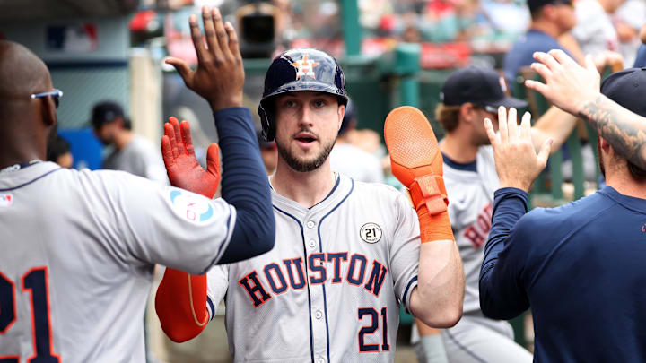 Houston Astros right fielder Kyle Tucker is greeted in the dugout after scoring a run.