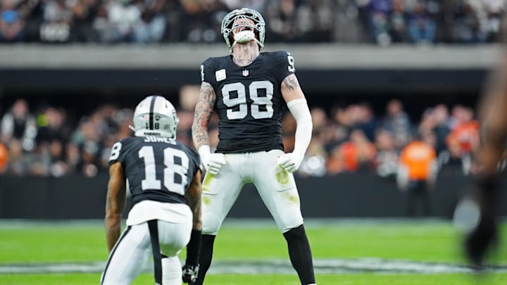 Jan 7, 2024; Paradise, Nevada, USA; Las Vegas Raiders defensive end Maxx Crosby (98) celebrates after sacking Denver Broncos quarterback Jarrett Stidham (4) during the second quarter at Allegiant Stadium. Mandatory Credit: Stephen R. Sylvanie-Imagn Images Jan 7, 2024; Paradise, Nevada, USA; Las Vegas Raiders defensive end Maxx Crosby (98) celebrates after sacking Denver Broncos quarterback Jarrett Stidham (4) during the second quarter at Allegiant Stadium. Mandatory Credit: Stephen R. Sylvanie-Imagn Images