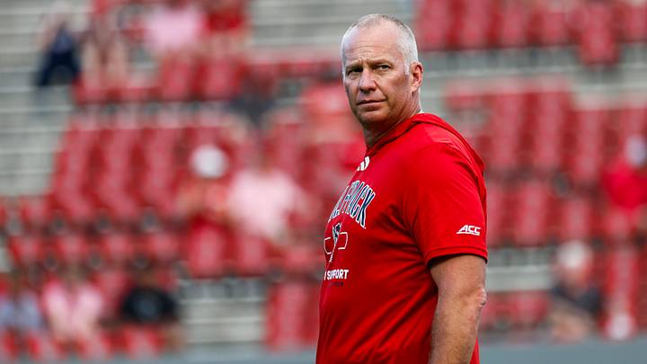 Sep 11, 2026; Raleigh, North Carolina, USA; NC State Wolfpack head coach Dave Doeren looks on during the warmups of the game against Richmond Spiders at Carter-Finley Stadium. Mandatory Credit: Jaylynn Nash-Imagn Images Sep 11, 2026; Raleigh, North Carolina, USA; NC State Wolfpack head coach Dave Doeren looks on during the warmups of the game against Richmond Spiders at Carter-Finley Stadium. Mandatory Credit: Jaylynn Nash-Imagn Images
