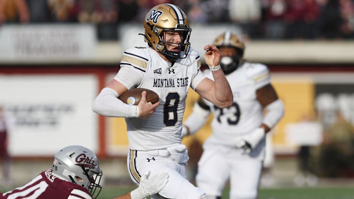 Montana State Bobcats quarterback Justin Lamson (8) carries the ball and scores a touchdown against Montana Grizzlies safety TJ Rausch (10) Montana State Bobcats quarterback Justin Lamson (8) carries the ball and scores a touchdown against Montana Grizzlies safety TJ Rausch (10)