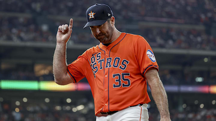Houston Astros starting pitcher Justin Verlander motions to the crowd while walking to the dugout.