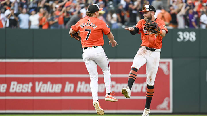 Aug 24, 2024; Baltimore, Maryland, USA; Baltimore Orioles second baseman Jackson Holliday (7) celebrates with outfielder Colton Cowser (17) after the game against the Houston Astros at Oriole Park at Camden Yards.