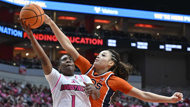Louisville Cardinals guard Reyna Scott and Virginia Cavaliers forward Caitlin Weimar