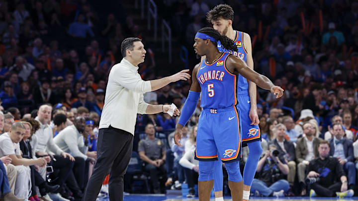 Jan 31, 2024; Oklahoma City, Oklahoma, USA; Oklahoma City Thunder head coach Mark Daigneault talks to Oklahoma City Thunder guard Luguentz Dort (5) and forward Chet Holmgren (7) during a time out against the Denver Nuggets in the second half at Paycom Center. Mandatory Credit: Alonzo Adams-Imagn Images Jan 31, 2024; Oklahoma City, Oklahoma, USA; Oklahoma City Thunder head coach Mark Daigneault talks to Oklahoma City Thunder guard Luguentz Dort (5) and forward Chet Holmgren (7) during a time out against the Denver Nuggets in the second half at Paycom Center. Mandatory Credit: Alonzo Adams-Imagn Images