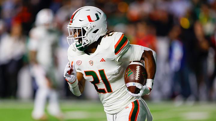 Oct 14, 2023; Chapel Hill, North Carolina, USA; Miami Hurricanes running back Henry Parrish Jr. (21) carries the football against the North Carolina Tar Heels in the first half at Kenan Memorial Stadium. Mandatory Credit: Nell Redmond-USA TODAY Sports