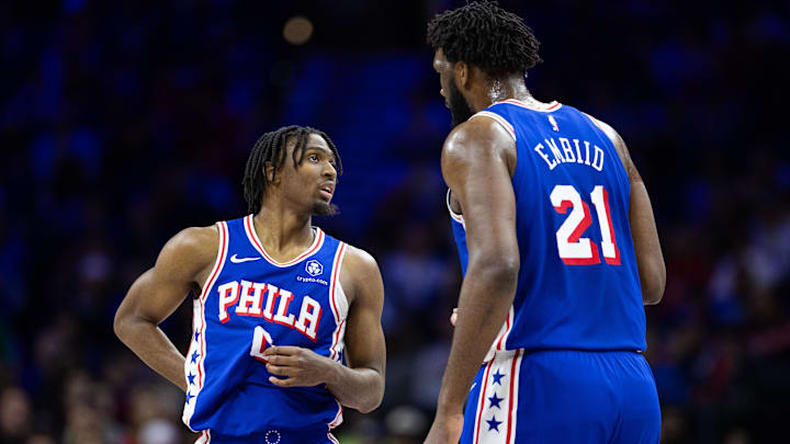 Jan 15, 2024; Philadelphia, Pennsylvania, USA; Philadelphia 76ers center Joel Embiid (21) and guard Tyrese Maxey (0) talk during a break in action in the first quarter against the Houston Rockets at Wells Fargo Center. Mandatory Credit: Bill Streicher-Imagn Images