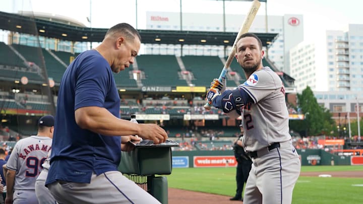 Aug 22, 2024; Baltimore, Maryland, USA; Houston Astros designated hitter Alex Bregman (right) works with hitting coach Alex Cintron (left) prior to the game against the Baltimore Orioles at Oriole Park at Camden Yards. Aug 22, 2024; Baltimore, Maryland, USA; Houston Astros designated hitter Alex Bregman (right) works with hitting coach Alex Cintron (left) prior to the game against the Baltimore Orioles at Oriole Park at Camden Yards.