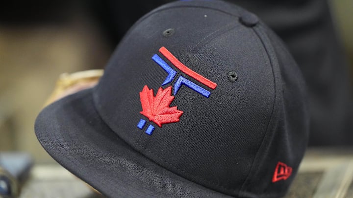 Jul 18, 2025; Toronto, Ontario, CAN; A Toronto Blue Jays ball cap sit in the dug out during the eighth inning against the San Francisco Giants at Rogers Centre. Mandatory Credit: John E. Sokolowski-Imagn Images