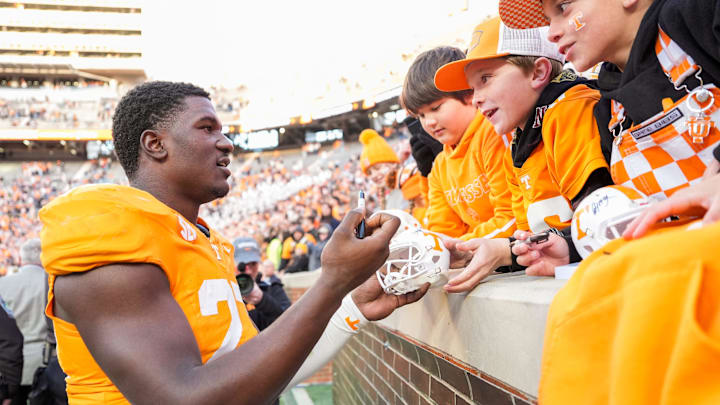 Tennessee defensive lineman James Pearce Jr. autographs items for children after a college football game between Tennessee and UTEP at Neyland Stadium in Knoxville, Tennessee, on Saturday, Nov. 23, 2024.