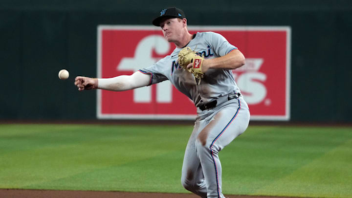 Jun 27, 2025; Phoenix, Arizona, USA; Miami Marlins first base Eric Wagaman (33) makes the play for an out against the Arizona Diamondbacks in the third inning at Chase Field. Mandatory Credit: Rick Scuteri-Imagn Images Jun 27, 2025; Phoenix, Arizona, USA; Miami Marlins first base Eric Wagaman (33) makes the play for an out against the Arizona Diamondbacks in the third inning at Chase Field. Mandatory Credit: Rick Scuteri-Imagn Images