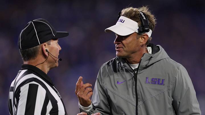 LSU Tigers head coach Lane Kiffin speaks with a referee during the second quarter against the Kentucky Wildcats at Kroger Field. LSU Tigers head coach Lane Kiffin speaks with a referee during the second quarter against the Kentucky Wildcats at Kroger Field.