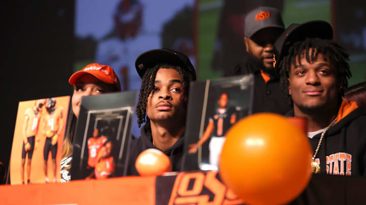 Rodney Fields, right, and LaDainian Fields wait to sign with Oklahoma State University during a signing day ceremony at Del City High School in Del City, Okla., Friday, Jan. 19, 2024. Rodney Fields, right, and LaDainian Fields wait to sign with Oklahoma State University during a signing day ceremony at Del City High School in Del City, Okla., Friday, Jan. 19, 2024.