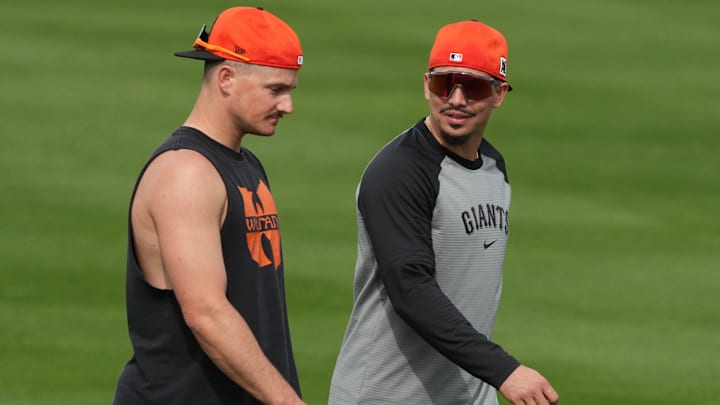 Feb 13, 2025; Scottsdale, AZ, USA; San Francisco Giants third base Matt Chapman (26) and shortstop Willy Adames (2) talk during spring training camp.