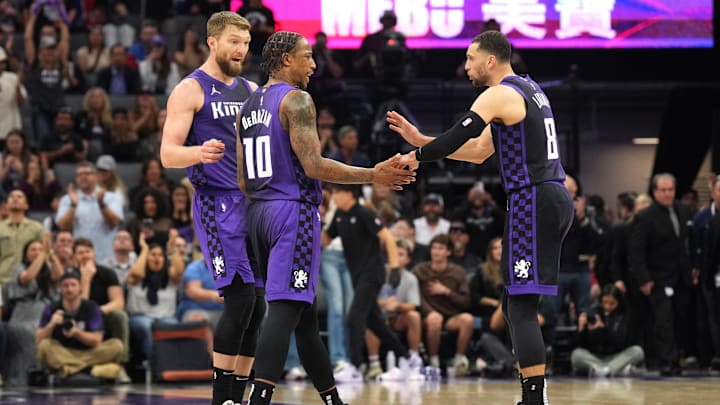 Apr 11, 2025; Sacramento, California, USA; Sacramento Kings forward DeMar DeRozan (10) talks with forward Domantas Sabonis (left) and guard Zach LaVine (8) during the fourth quarter against the Los Angeles Clippers at Golden 1 Center. Mandatory Credit: Darren Yamashita-Imagn Images