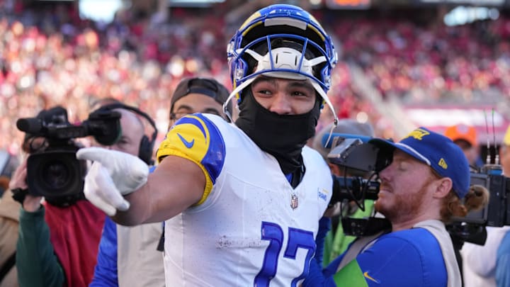 Jan 7, 2024; Santa Clara, California, USA; Los Angeles Rams wide receiver Puka Nacua (17) gestures on the sideline after setting the NFL record for receiving yards in a season by a rookie during the third quarter against the San Francisco 49ers at Levi's Stadium. Mandatory Credit: Darren Yamashita-Imagn Images