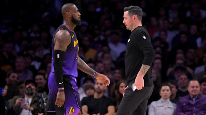 Jan 2, 2025; Los Angeles, California, USA: Los Angeles Lakers forward LeBron James (23) walks past head coach JJ Redick during a time out against the Portland Trail Blazers in the second half at Crypto.com Arena. Mandatory Credit: Jayne Kamin-Oncea-Imagn Images Jan 2, 2025; Los Angeles, California, USA: Los Angeles Lakers forward LeBron James (23) walks past head coach JJ Redick during a time out against the Portland Trail Blazers in the second half at Crypto.com Arena. Mandatory Credit: Jayne Kamin-Oncea-Imagn Images