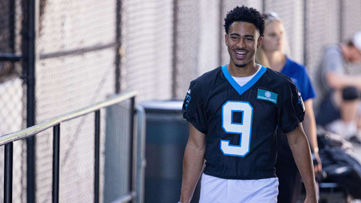 Jul 23, 2025; Charlotte, NC, USA; Carolina Panthers quarterback Bryce Young (9) walks to the field for Panthers Training Camp. Mandatory Credit: Scott Kinser-Imagn Images