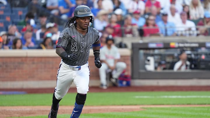 Sep 21, 2024; New York City, New York, USA;  New York Mets shortstop Luisangel Acuna (2) runs to first base during the game against the Philadelphia Phillies at Citi Field. Mandatory Credit: Lucas Boland-Imagn Images