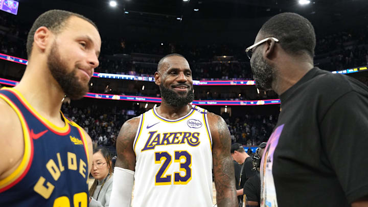 Jan 25, 2025; San Francisco, California, USA; Los Angeles Lakers forward LeBron James (23) talks with Golden State Warriors guard Stephen Curry (30) and forward Draymond Green (right) after the game at Chase Center. Mandatory Credit: Darren Yamashita-Imagn Images