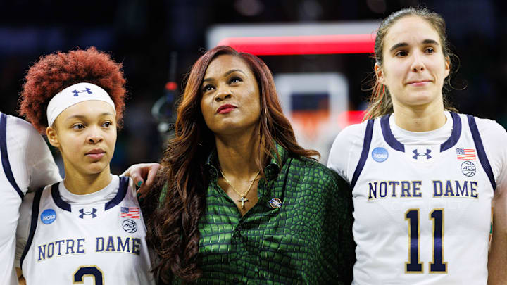 Notre Dame head coach Niele Ivey, center, guards Hannah Hidalgo (3) and Sonia Citron (11) look on after winning the second round of the NCAA Women's Basketball Tournament 76-55 against Michigan at Purcell Pavilion on Sunday, March 23, 2025, in South Bend.