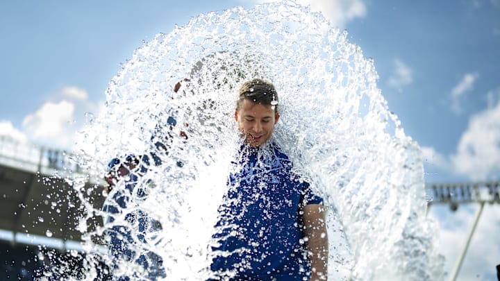 May 8, 2025; Kansas City, Missouri, USA; Kansas City Royals starting pitcher Kris Bubic (50) is doused by shortstop Bobby Witt Jr. (7) after defeating the Chicago White Sox at Kauffman Stadium. Mandatory Credit: Jay Biggerstaff-Imagn Images