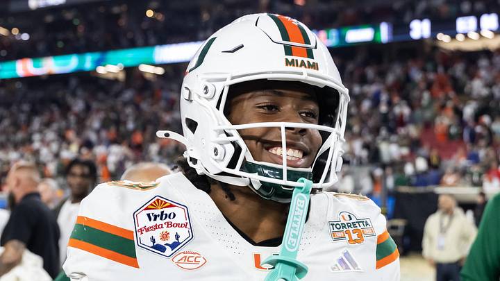 Jan 8, 2026; Glendale, AZ, USA; Miami Hurricanes defensive back Bryce Fitzgerald (13) celebrates after defeating the Mississippi Rebels during the 2026 Fiesta Bowl and semifinal game of the College Football Playoff at State Farm Stadium. Mandatory Credit: Mark J. Rebilas-Imagn Images