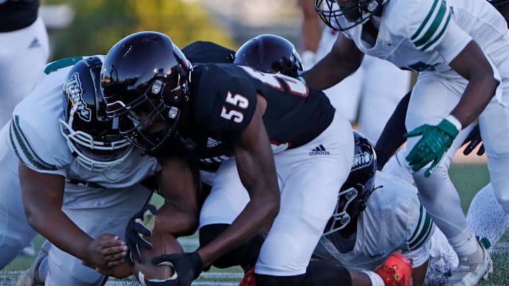 Lafayette Jeff Bronchos Aaden Aytch (55) dives on a fumble during the IHSAA football game against the Arsenal Tech Titans, Friday, Sept. 1, 2023, at Lafayette Jeff High School in Lafayette, Ind. Lafayette Jeff Bronchos won 50-12. Lafayette Jeff Bronchos Aaden Aytch (55) dives on a fumble during the IHSAA football game against the Arsenal Tech Titans, Friday, Sept. 1, 2023, at Lafayette Jeff High School in Lafayette, Ind. Lafayette Jeff Bronchos won 50-12.