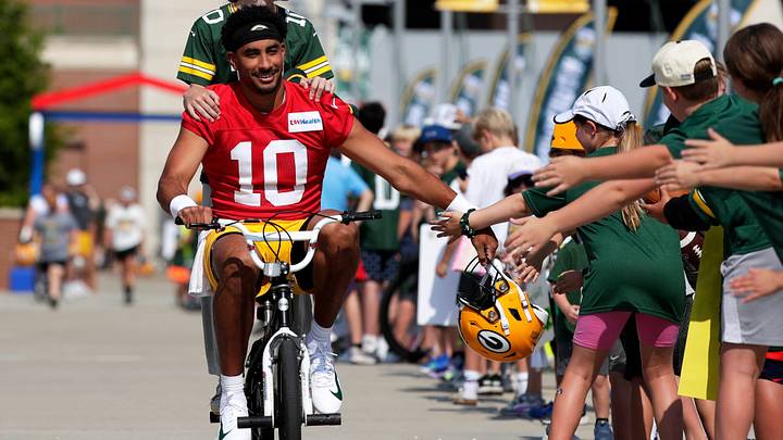 Green Bay Packers quarterback Jordan Love (10) participates in the DreamDrive bicycle ride with a young fan on the way to practice July 30, 2026, in Green Bay, Wis. Green Bay Packers quarterback Jordan Love (10) participates in the DreamDrive bicycle ride with a young fan on the way to practice July 30, 2026, in Green Bay, Wis.